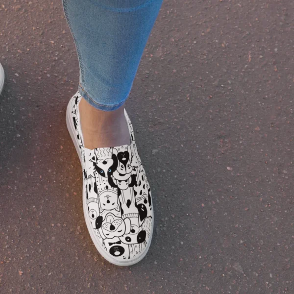 a womans canvas shoe with an all over cartoon dog print. Very cute for dog moms